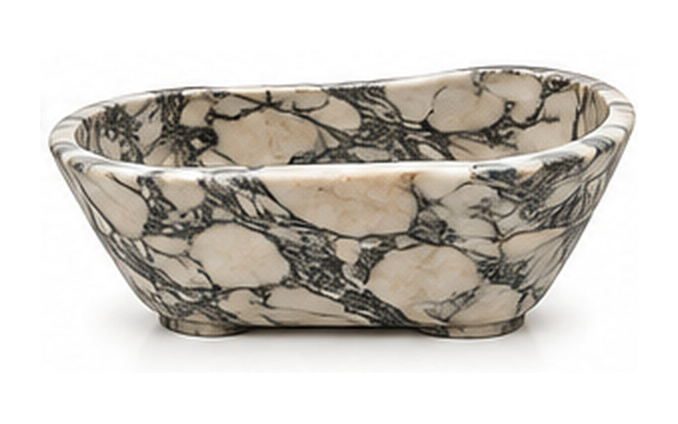 Concept image of a sculptural freestanding bathtub in Arabescado natural stone, Vero Marble