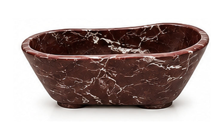 Concept image of a sculptural freestanding bathtub in Rosso Levanto natural stone, Vero Marble